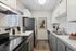 Arrive 800 Penn Modern Kitchen with Stainless Steel Appliances and White and Gray Cabinetry