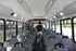 Interior view of a modern bus with ample seating and sleek design.
