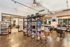 Inviting cafe lounge with snack shelves, modern seating, and cozy ambiance.