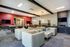 Modern lounge featuring stylish seating, sleek lighting, and entertainment amenities.