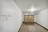 Clean and bright garage space with a secure door and ample storage potential.