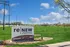 Bright day view of Renew Edwardsville entrance sign surrounded by lush green landscape.
