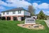 Charming townhouse exterior with well-maintained lawn and welcoming atmosphere at Renew Edwardsville.