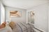 Inviting bedroom with contemporary decor, featuring a comfortable bed, stylish artwork, and mirrored closet doors.