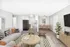 Bright living room with modern furniture, a dining area, and an adjacent kitchen in a cozy apartment.