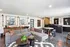 Stylish modern living room with a cozy grey sectional sofa, elegant artwork, and a welcoming ambiance.