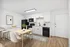 Bright kitchen and dining area with modern appliances, white cabinetry, and a minimalist dining table.