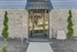 Inviting leasing center entrance with glass doors and modern brick exterior.