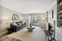 Bright and stylish living room with modern design, featuring a comfortable sofa, elegant coffee table, and inviting fireplace.