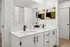 Luxurious bathroom with dual sinks, modern fixtures, and stylish decor.