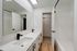 Contemporary bathroom featuring a sleek double sink vanity with modern fixtures and ample lighting.