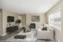 Bright and modern living room with elegant furnishings, natural light, and minimalist decor.