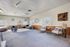 Bright and inviting living room with contemporary furniture, stylish decor, and large windows.