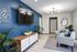 Alturas Penbrook Living Room with Wide Screen TV, Modern Lighting, and Seating Area