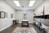 Contemporary office space with sleek furniture, modern artwork, and natural lighting.