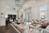Spacious modern living room with comfortable seating, sleek decor, and abundant natural light.