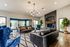 Sophisticated living room with plush seating, stylish chandelier, and modern decor.
