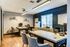 Chic and modern home office with elegant desks, stylish chairs, and ample natural light.