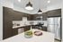 Contemporary kitchen with dark cabinets, stainless steel appliances, and an elegant island.