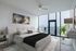 Luxurious bedroom with stunning city view, featuring a plush bed, modern decor, and floor-to-ceiling windows for abundant natural light.