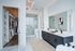 Luxurious modern bathroom with spacious walk-in closet, sleek double sinks, and elegant marble shower.
