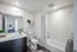 888 at Grand Hope Park Modern Bathroom Featuring a Vanity with Bright Lighting