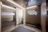 888 at Grand Hope Park Lobby Showcasing Elevator Doors and Design Elements with Illuminated '888
