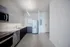 888 at Grand Hope Park Renovated Kitchen with Stainless Steel Appliances and Modern Cabinetr