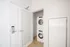 888 at Grand Hope Park Apartment In-Unit Laundry Closet with Stacked Washer and Dryer Set