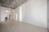 888 at Grand Hope Park Modern Open-concept apartment with sleek wooden floors and a stylish kitchen, featuring high ceilings and natural lighting.