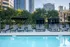 888 at Grand Hope Park Luxurious Pool Featuring Cabanas and Pool Chairs with City Views.