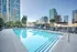 888 at Grand Hope Park Luxurious Rooftop Pool with City Views and Lounge Chairs on Sundeck