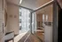 888 at Grand Hope Park Sauna Room with Wide Mirror and Modern Wood Finishes and Floor-to-Ceiling Window