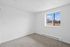 Bright and airy room with a large window showcasing a scenic outdoor view, perfect for a peaceful retreat.