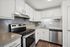 Modern kitchen with sleek white cabinetry, stainless steel appliances, and polished countertops, perfect for culinary creativity.