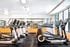 Modern fitness center with state-of-the-art treadmills and ample natural light.