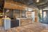 Chic modern lobby with rustic wood accents, elegant lighting fixtures, and a welcoming atmosphere.