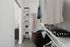 Modern walk-in closet with organized shelves, hanging space, and stylish clothing, optimizing storage and style.