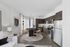 Chic open-plan kitchen and living area with modern appliances, stylish dining space, and elegant decor radiates urban sophistication.