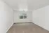 Bright and inviting bedroom with plush carpeting, large window, and ample natural light.
