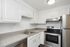 Bright modern kitchen featuring sleek stainless steel appliances, elegant white cabinetry, and ample counter space for culinary adventures.