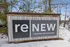 Stylish signage for ReNew Taunton on Highland surrounded by a light dusting of snow, offering a welcoming and modern atmosphere.