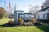 Inviting exterior of reNEW White Marsh with manicured landscaping, creating a welcoming entrance.