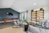 Modern lounge area with plush seating, a stylish pool table, and wall-mounted TV, perfect for relaxation and entertainment.
