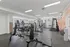 Bright, spacious fitness center with modern gym equipment and vibrant decor offering a dynamic workout atmosphere.