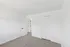 Bright and inviting bedroom with fresh white walls, cozy carpeted floor, and ample closet space, offering a blank canvas for personalization.