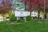 Charming Zen Long Island sign surrounded by vibrant pink blossoms and lush greenery, ideal for tranquil living in West Babylon.
