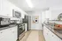 Arrive Fort Lee Kitchen with White Cabinetry and Stainless Steel Appliances