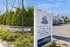 Inviting entrance sign for Zen Long Island at Oyster Bay, surrounded by lush greenery and serene atmosphere.