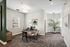 Elegant and modern office space with stylish desk, artwork, and a large potted plant offering a refreshing and professional environment.